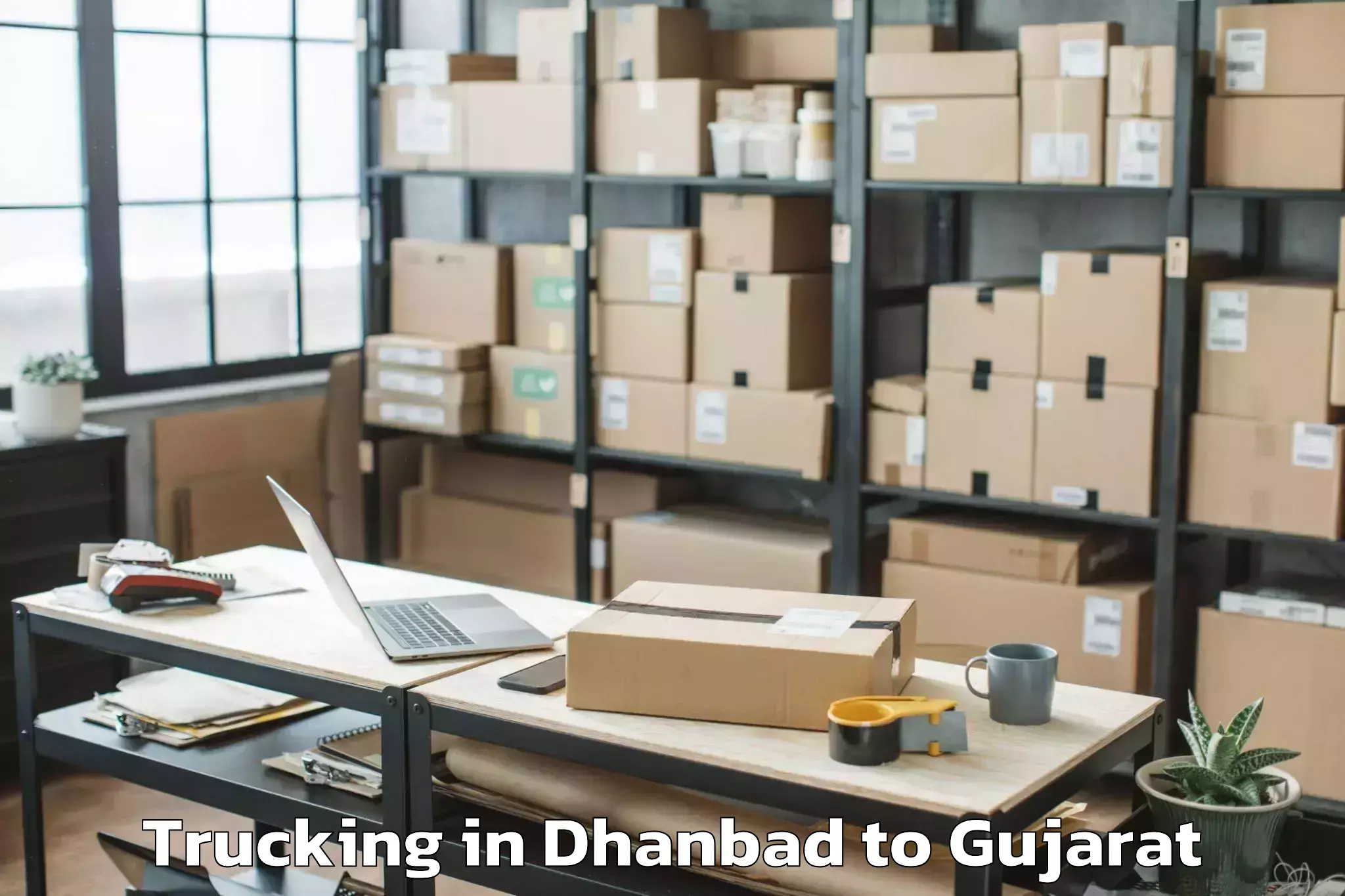 Expert Dhanbad to Ahwa Trucking